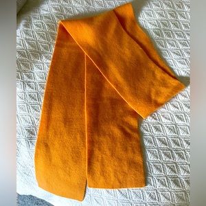 Orange cashmere scarf. 5” wide. 64” long.